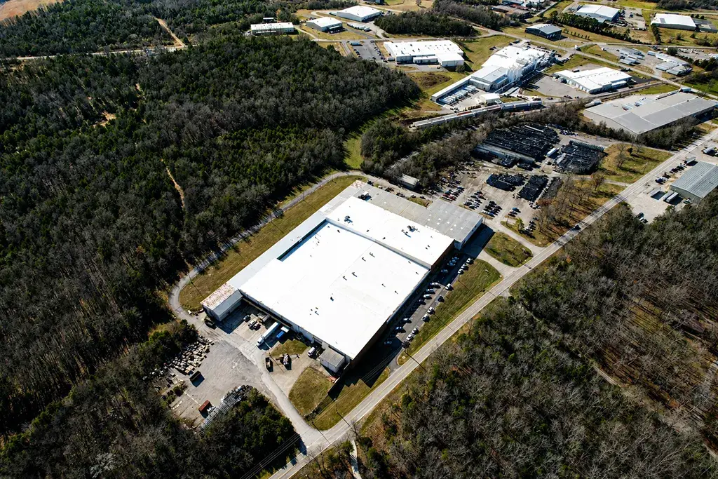 Aerial view of an industrial facility at golden hour